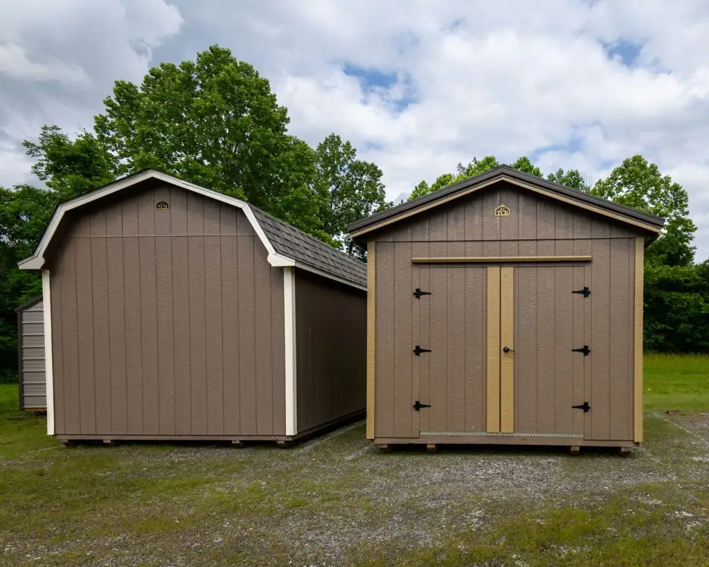 Two portable storage buildings. Painted urban shed and lofted garage.